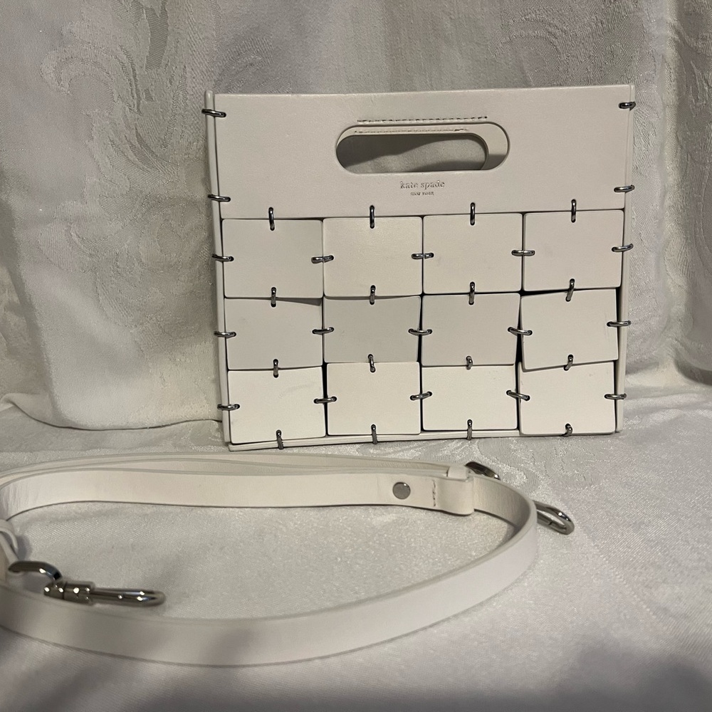 Kate Spade “Celia” leather top handle clutch